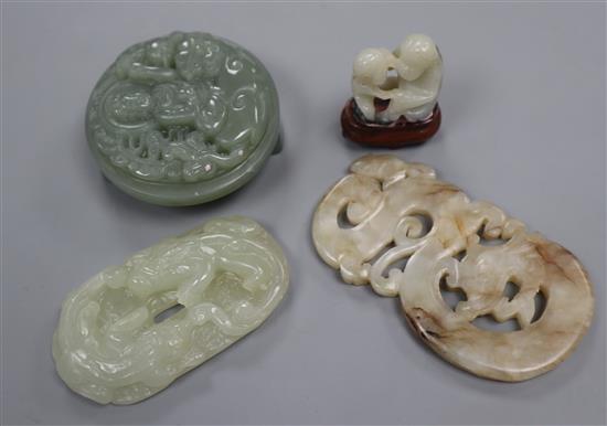 Two Chinese jade plaques and a belt buckle and a monkey group